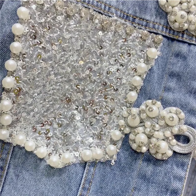 Jaqueta jeans feminina com fivela de grânulo