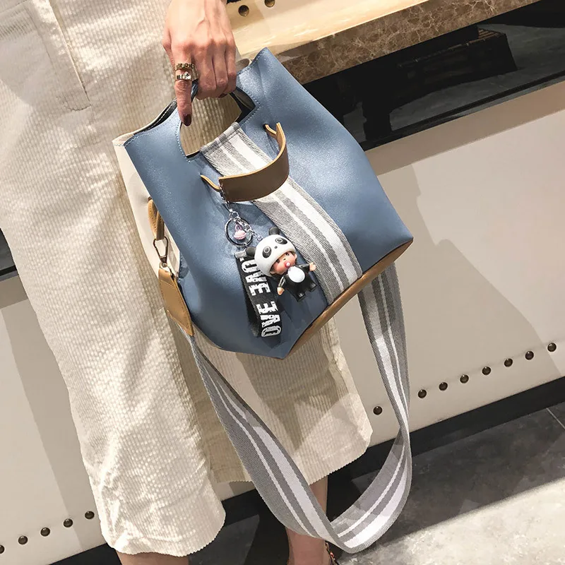 

2018 Early Spring South Korea Simple Ribbon Bucket Type WOMEN'S Bag Portable Shoulder Bag Cartoon Pendant Bags One's
