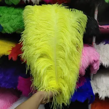 

Hot sales! 100 PCS pretty Fluorescein Yellow ostrich feather 50-55 cm/20-22 inch plume wedding performing art decoration feather