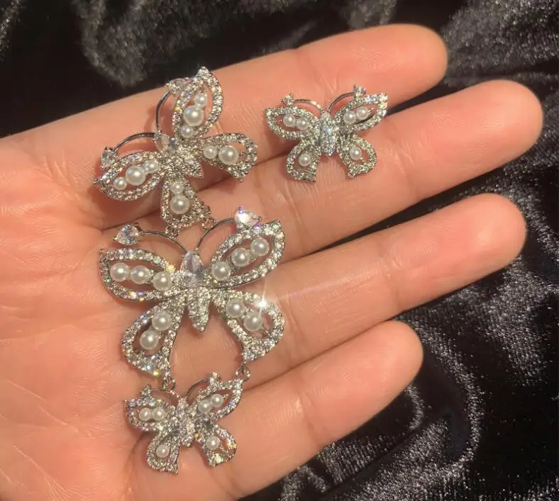 

Asymmetric butterfly pearl earrings ladies micro-inlaid zircon exaggeration long insects ear accessories