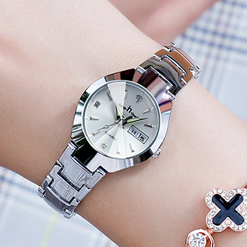 A woman's wrist adorned with a stylish silver Small Dial Ladies Fashion Watch.