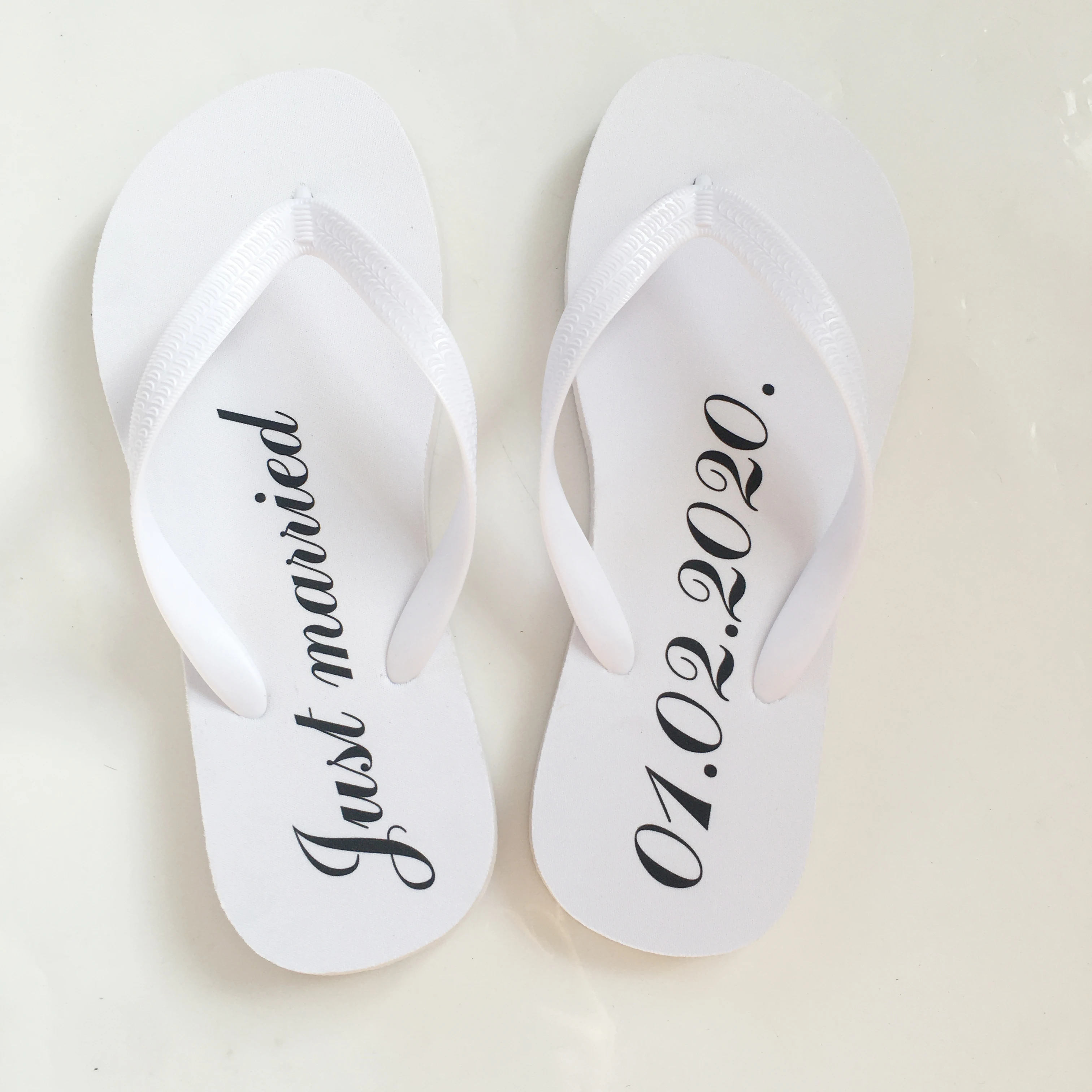 bride and groom flip flops