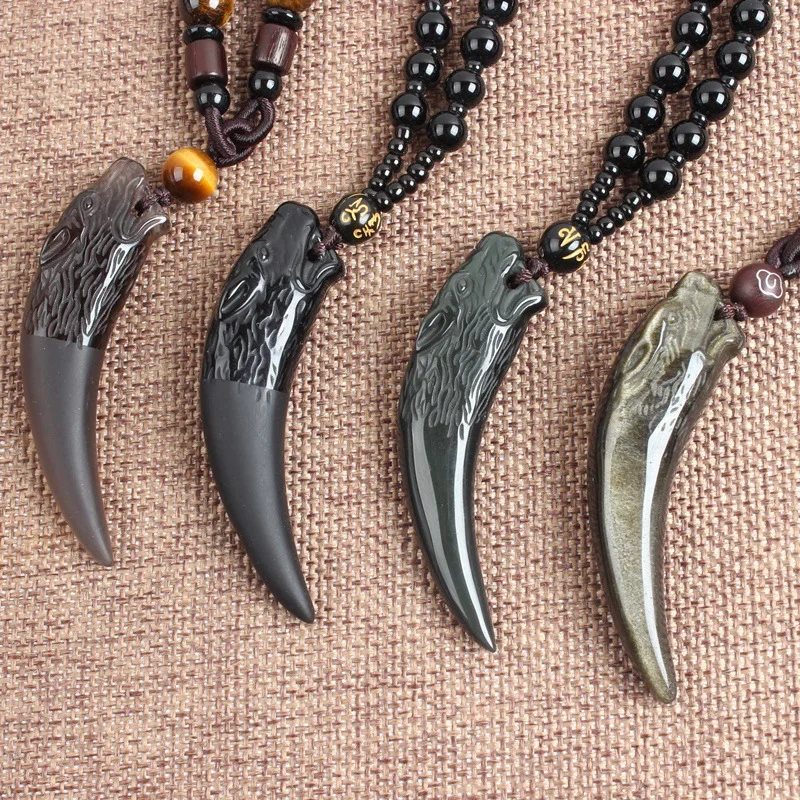 hand-carved the The tooth shape of the Wolf Chinese natural ice color obsidian 