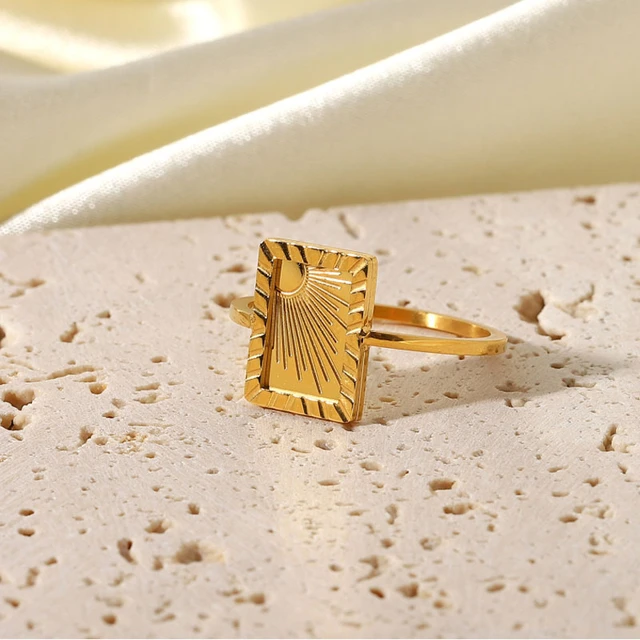 Close-up of his hands buttoning the button on his blue shirt. A middle-aged  adult man with a gold ring on his index finger. Person holding hands in mi  Stock Photo - Alamy