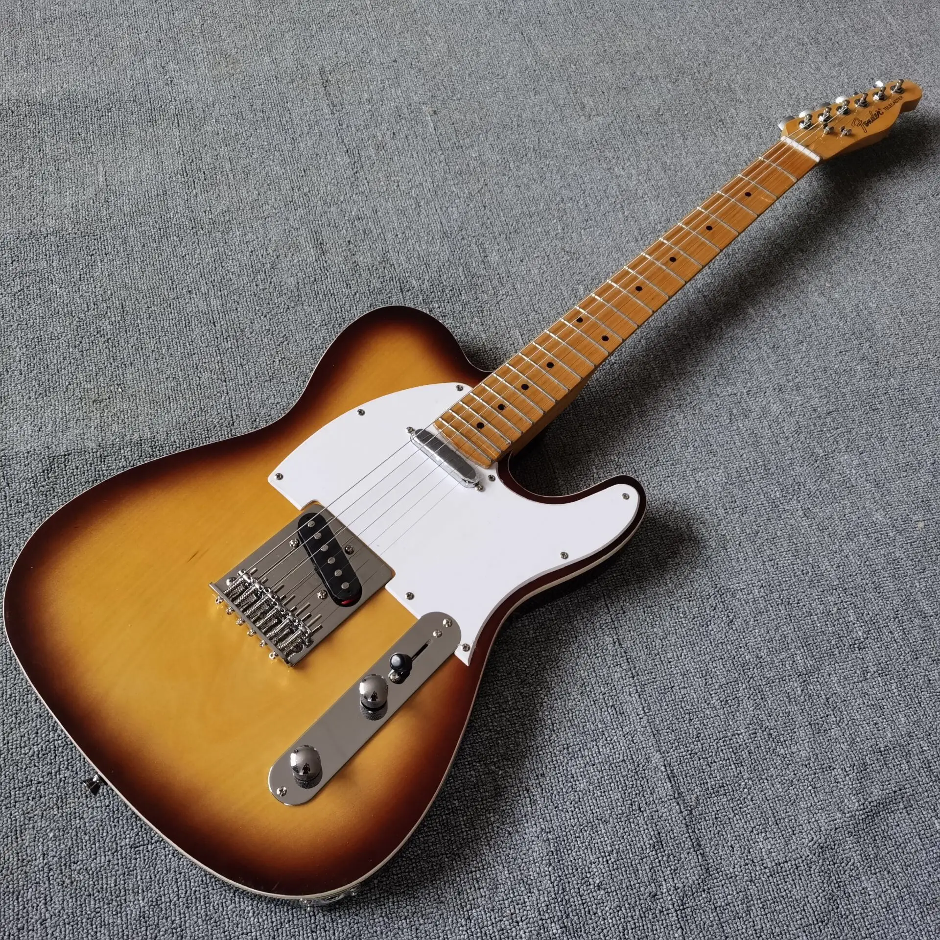 

New style.Sunburst color 6 stings Electric Guitar.white pickguard,high quality pickups.maple fingerboard.real photos