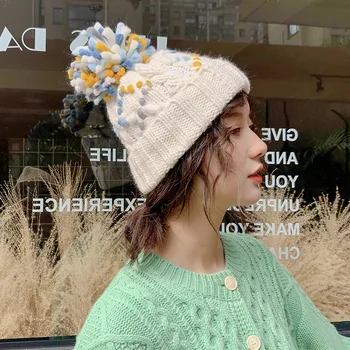 

Contrast color ball color point wool hat female autumn and winter warm ear protector Korean version of knitted hat winter