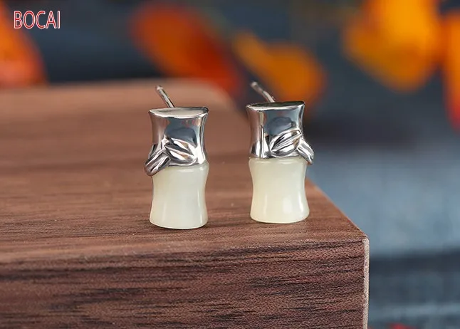 

Material: S925 sterling silver inlaid Hetian jade retro atmosphere bamboo joint wild and high-rise ladies earrings