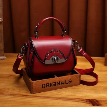 

Leather women's bag 2020 new vintage cowhide one-shoulder hand-held oblique straddle bag Guangzhou rivet saddle bag