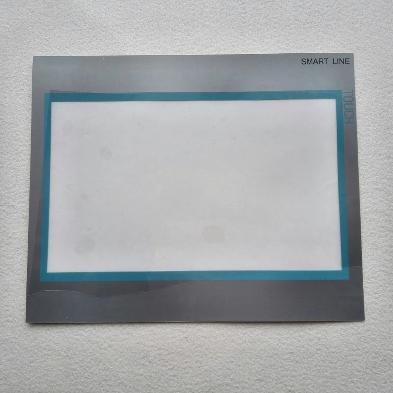 

Smart1000IE 6AV 6 648 6AV6648-0BE11-3AX0 Сенсорная панель + защита