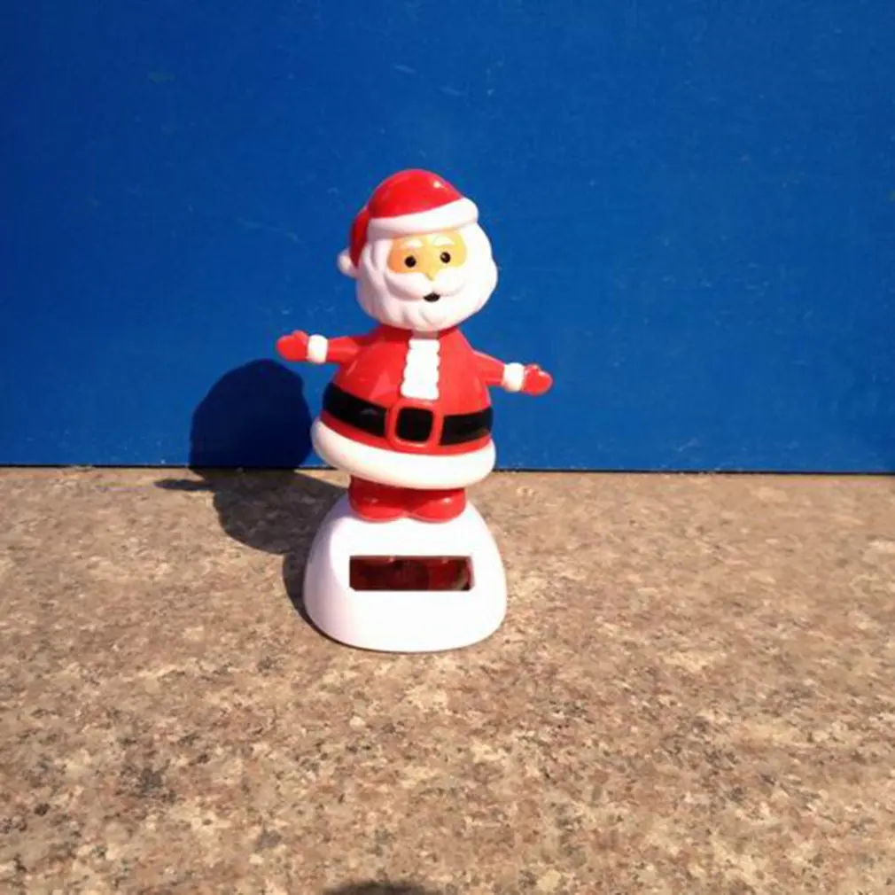 Santa Claus Elk Snowman Solar Shaking Head Action Figure Anime Penguin Angel Abs Toy Christmas Gift Car Interior Decoration