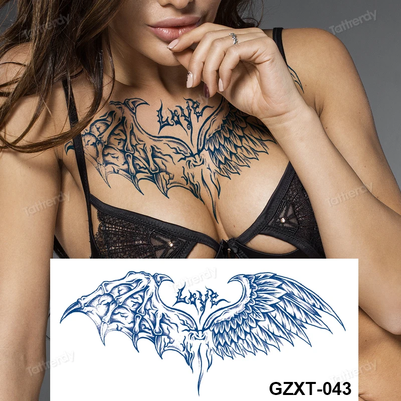 Cross Between Breast Tattoo