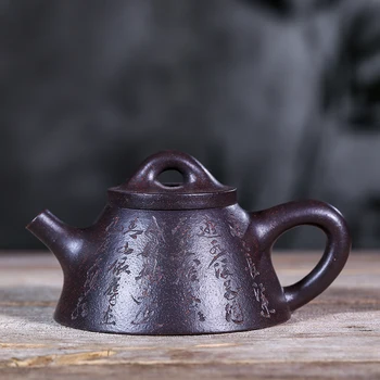 

Yixing recommended all hand undressed ore black cinnabar ba wang shi ladle pot of 220 ml of tea set