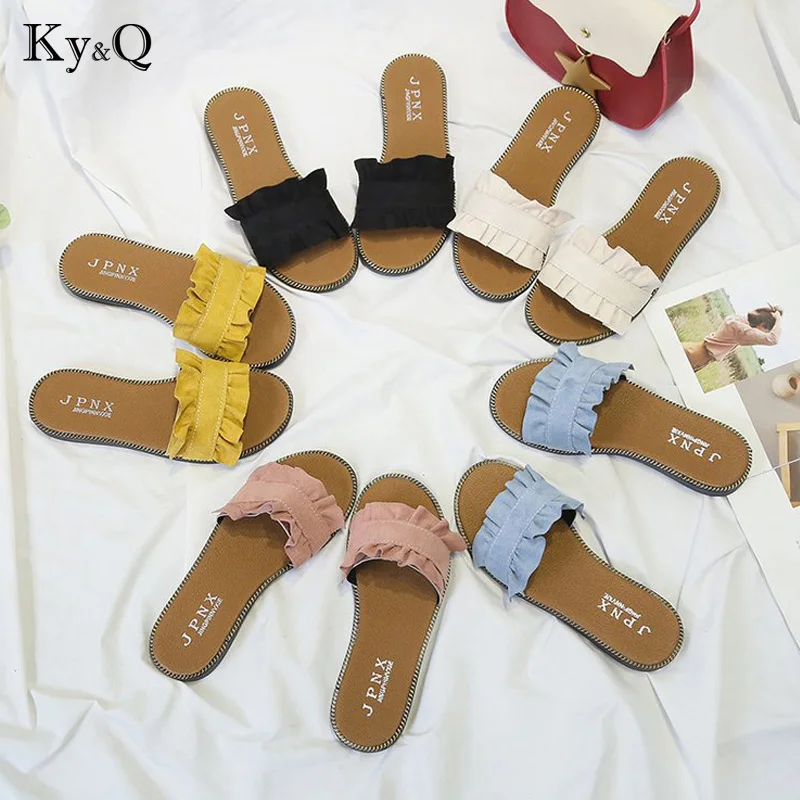 

2019 Summer New Ladies Slippers Fashion Pleated Wooden Ear Flat Sand Drag Korean Version Of The Wild Sweet Casual Beach Shoes
