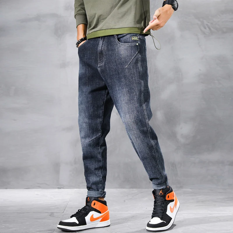 

Newly Designer Fashion Men Jeans Top Quality Retro Blue Elastic Loose Fit Denim Harem Pants Streetwear Hip Hop Wide Leg Trousers