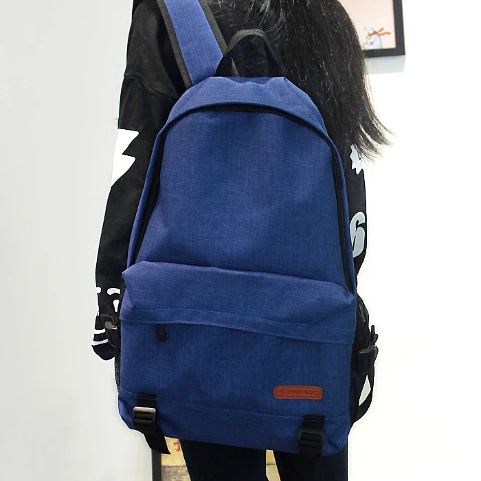 

Simple solid color large capacity backpack men and women Oxford spinning tide college wind leisure backpack middle school studen