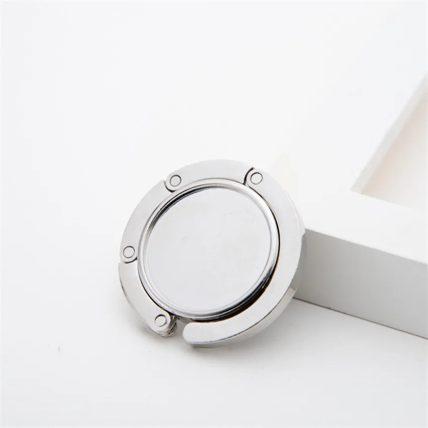 Description Picture 3 of itemPortable Bag Buckle Hook Hanger Creative Folding Handbag Holder Table Hooks Zinc Alloy Hanging Multi-Purpose Hooks Ornaments