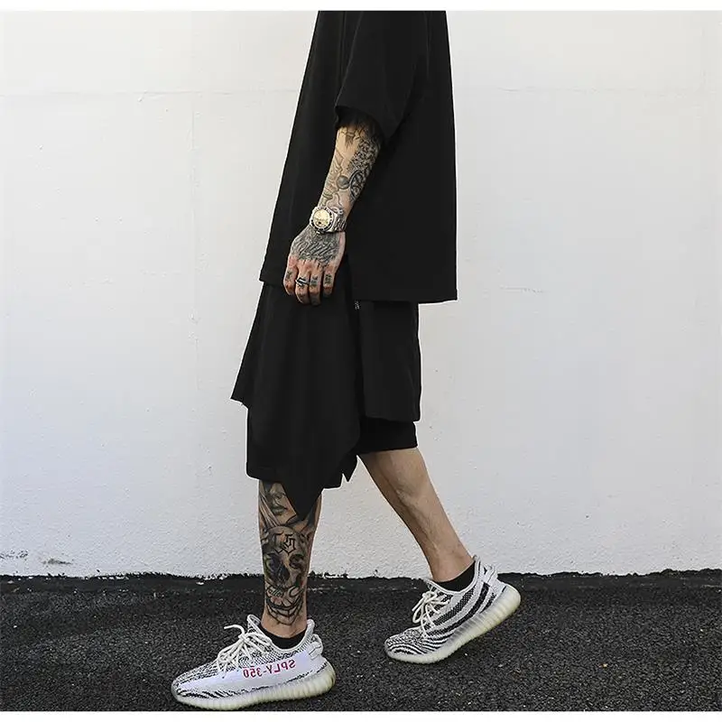 Men's hip-hop style personality trend asymmetry spliced tight waist five minute pants high street style harem pants