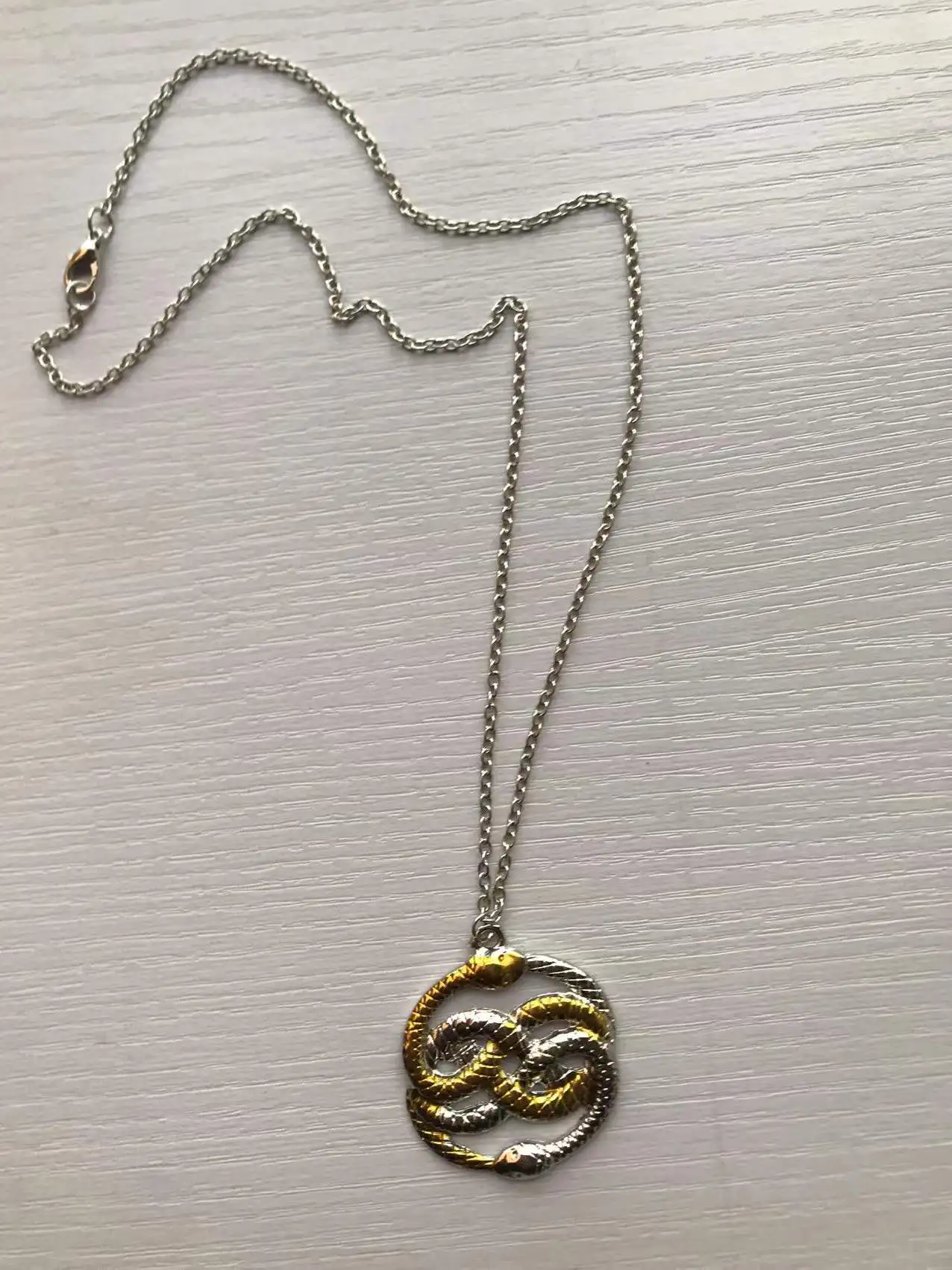 The AURYN Necklace from The Neverending Story - Dizaster In A Halo