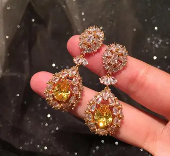 

Yellow flower earrings women super flash temperament fairy gorgeous exaggerated hollow ear jewelry