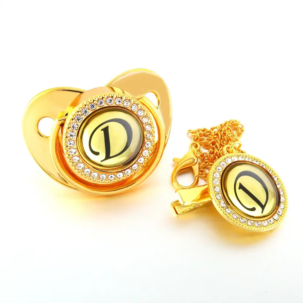 gold baby pacifier
