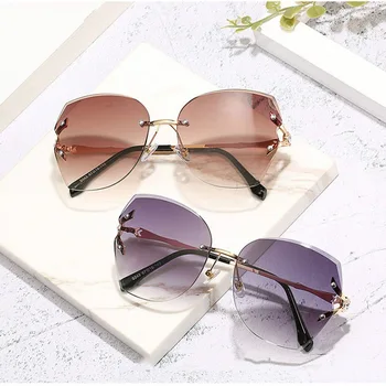 

2020 fashion new frameless sunglasses street shooting personality diamond large frame glasses gradient sunglasses women
