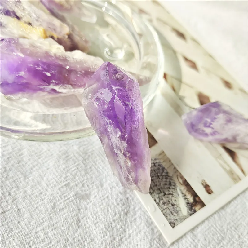 https://ae01.alicdn.com/kf/Hb68b8e961ce0448f95662ade42e6042bo/High-Quality-Raw-Rough-Purple-Amethyst-Dragon-Tooth-Wand-Points-Teeth-For-Christmas-Decorations.jpg