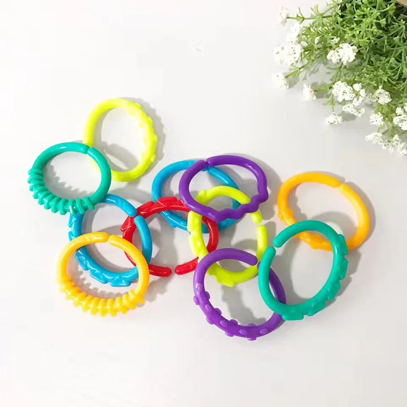 8Pcs/set Plastic Grip Baby Teether Rattles Rubber Rainbow Ring Molars Rattle Safety Toys for Children Crib Bed Stroller Hanging
