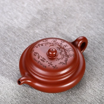 

Mud Dahongpao flat drum yixing teapot handmade authentic purple clay pot engraved with plum blossom