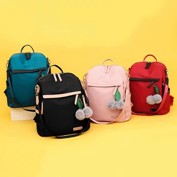 

2020 New Quality Hair Ball Pendant Backpack Waterproof Simple College Wind Bag Youth Girl Travel Backpack