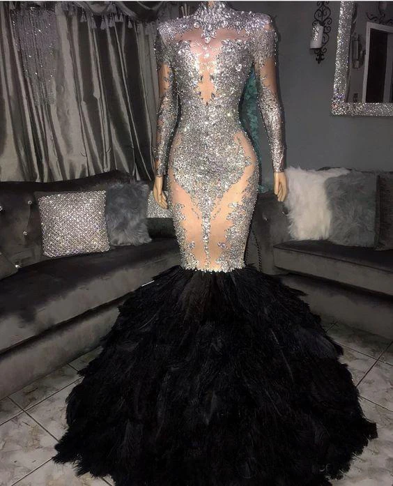 

Sparkly Silver Mermaid Prom Dresses 2020 Sheer Neck Long Sleeves With Black Feather Plus Size Formal Evening Occasion Gowns