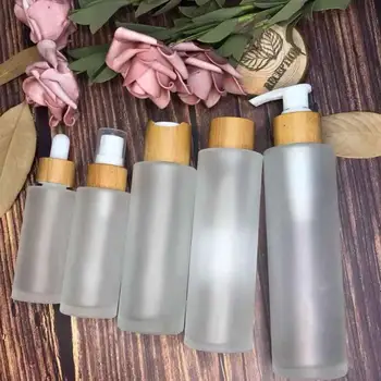 

4oz 1oz frosted clear glass jar bamboo bottle with lotion spray cap carving wood cosmetic skin care cream free sample