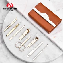 Три семь 777 Высококачественный золотой маникюрный набор из углеродистой стали, машинка для стрижки ногтей, педикюрный набор 8 в 1, домашний Роскошный деловой набор NTS-3004G