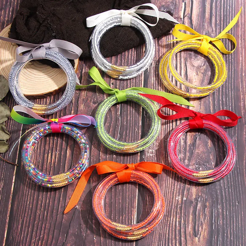 

JUST FEEL 5 PCS/Set All Weather Beads Glitter Bangles Wholesale Bowknot Plastic Stack Silicone Jelly Bangles Women Girl Bracelet