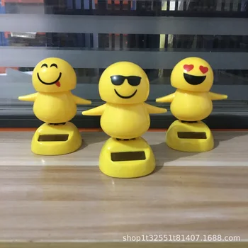 

Car accessories solar energy apple flower personality fashion creativity cute shake head doll expression bag car accessories