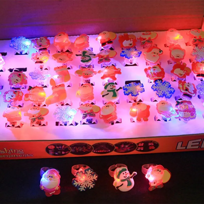 Рождественский светодиодный кольцо световой вспышки пальцевые кольца игрушки 50 шт. в упаковке вечерние Пользу Мигает прозрачные резиновые кольца для детей и взрослых подарки коробка наборы для ухода за кожей