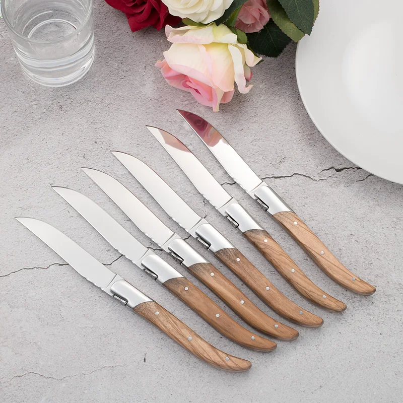 Laguiole steak knives with matt stainless steel bolsters. Wide rosewood  handles Length of handle 12 cm Steel blade Stainless 12C27Mod Bolsters 2  stainless steel bolsters in matt finish Chiseling Standard Nature of