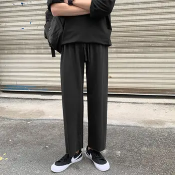

Men's casual pants 2020 spring and summer new solid color loose wild nine point guard pants youth fashion men's clothing