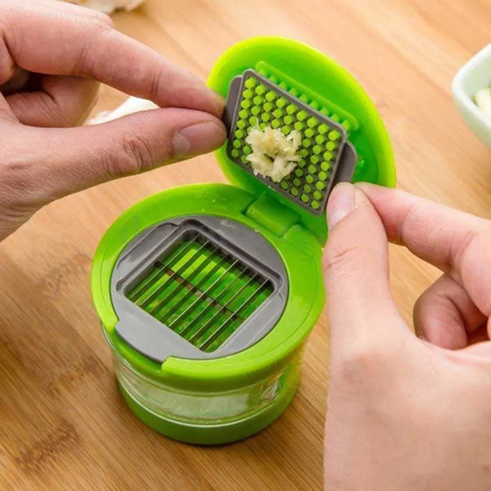 https://ae01.alicdn.com/kf/Hb9d23aa9a6f941678ac37a7be83eb9f6U/Creative-Garlic-Peel-Garlic-Press-Crusher-Mincer-Transparent-Storage-Container-Garlic-Chopper-Slicing-Dicing-Kitchen-Tools.jpg