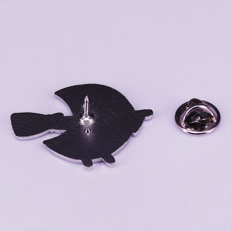 Way to showcase the whole movie in one magic brooch! Jiji's on a broom and the backdrop is a moon. 