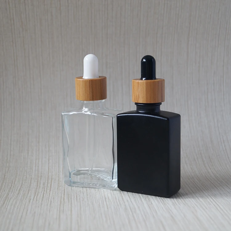 Пользовательский гравировальный логотип Экологичная косметическая упаковка для ухода за кожей контейнер CBD стеклянная бутылка-капельница 30 мл с бамбуковой крышкой 1 унц