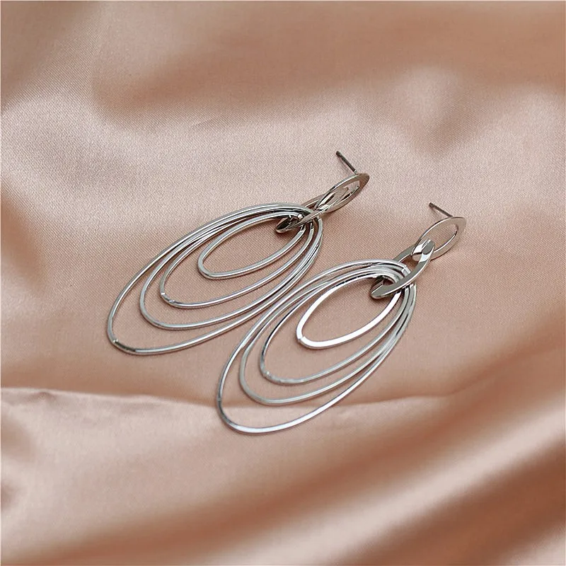 

The new long metallic element geometry exaggerates individual character lady eardrop