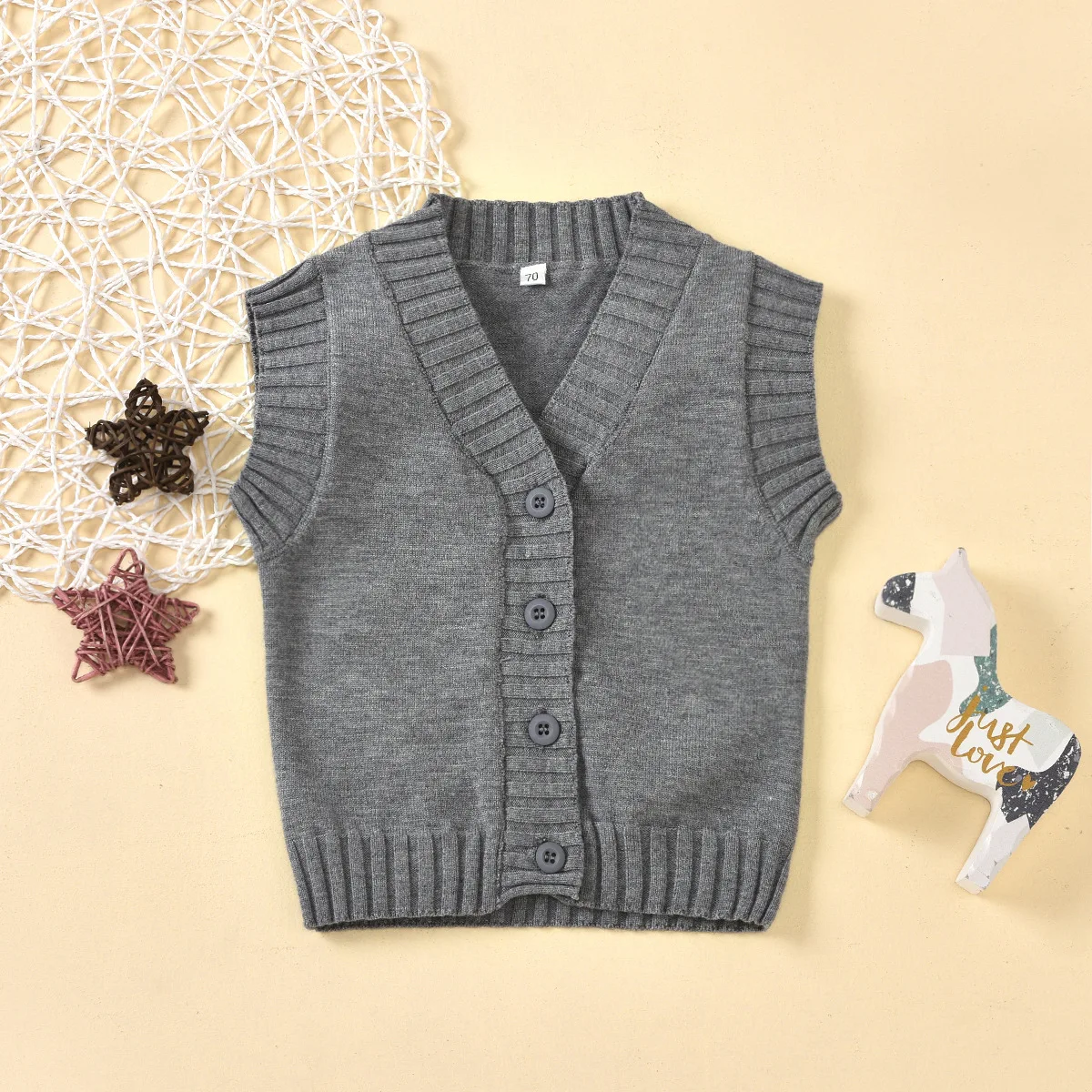 

Hot-selling children's autumn and winter knitted solid color warm V-neck cardigan short sleeve sweater