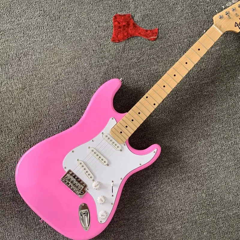 Classic pink electric guitar, grooved fingerboard, comfortable feel