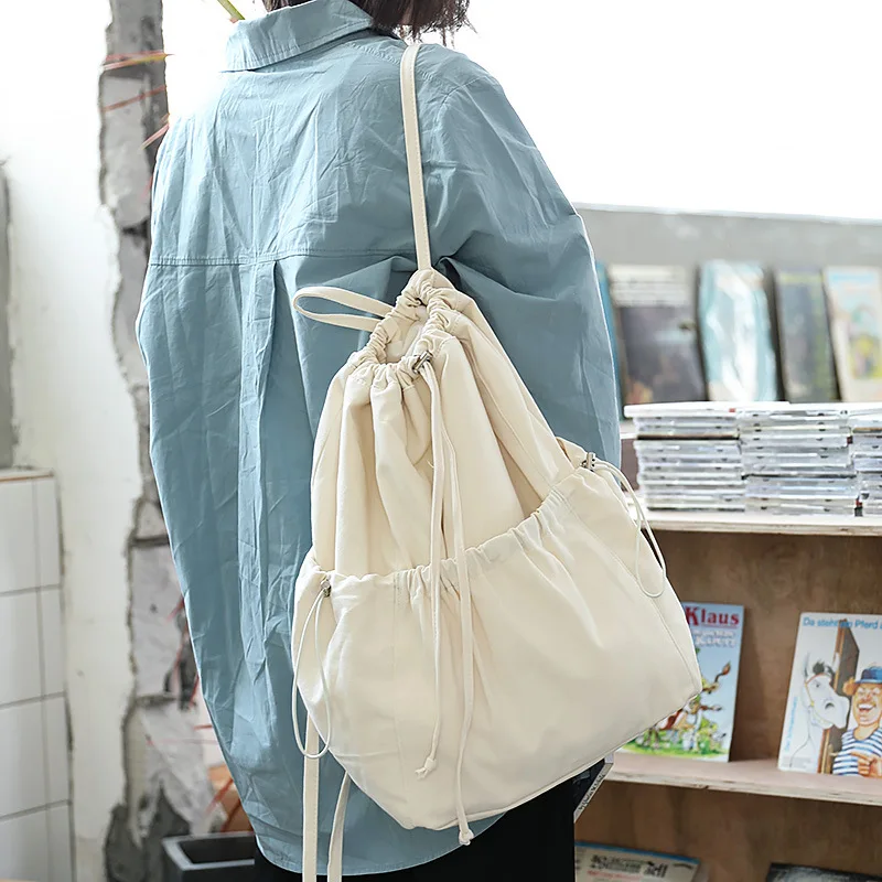 

Korean version of the simple small fresh backpack casual literature and art forest drawstring school bag wild student rucksack