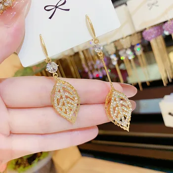 

Autumn winter new fund individual character is asymmetrical long leaf geometric earring leaf hollow-out dangle earring