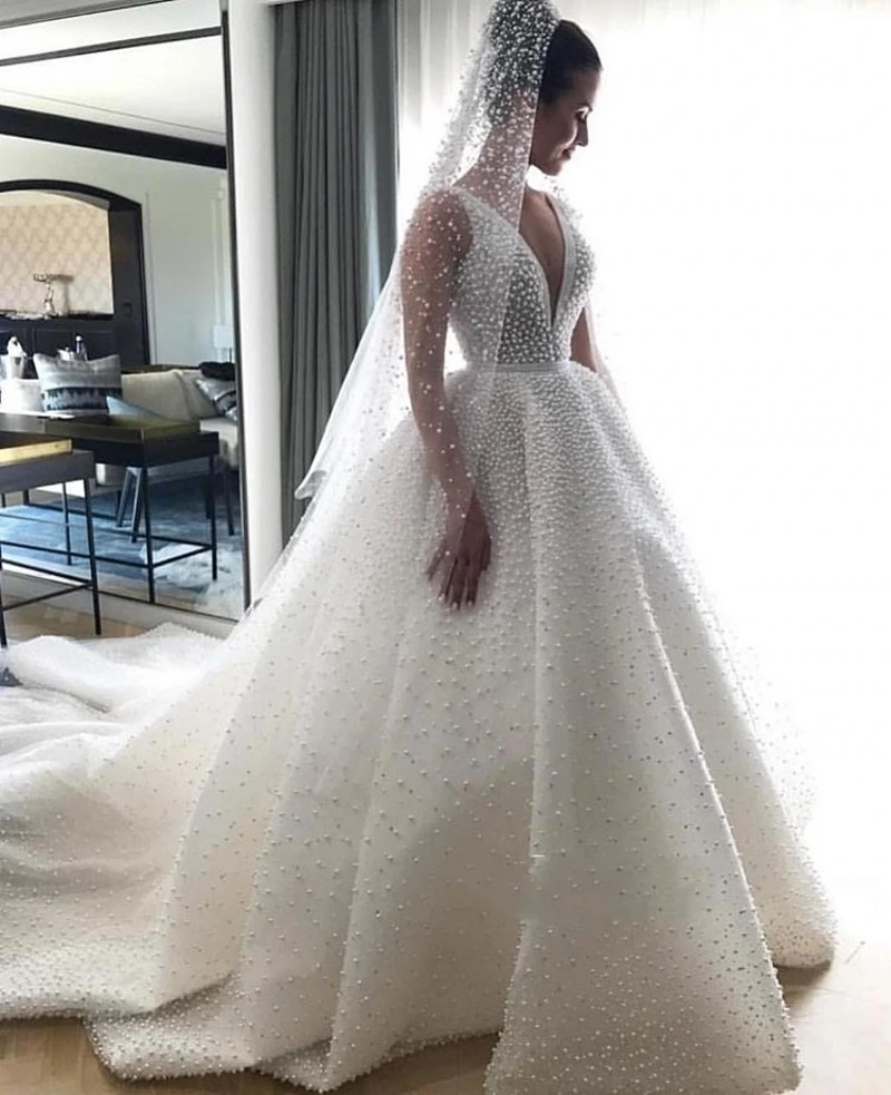 

Dubai Africa New Elegant V-Neck Sleeveless Wedding Dresses 2020 Princess Pearls Bridal Gowns Robe De Mariee