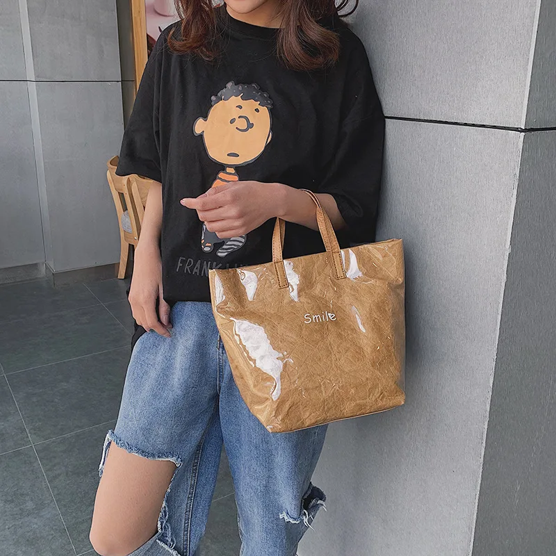 

Fashion letter transparent Kraft paper handbag large capacity single shoulder large bag pvc jelly waterproof beach bag