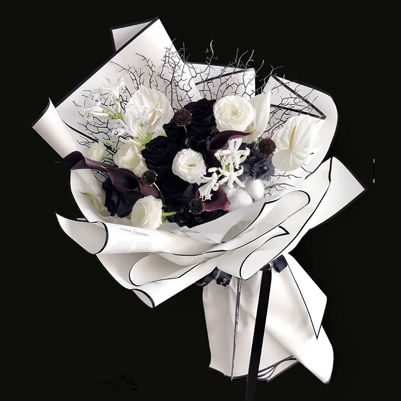 Flower bouquet with black wrapping paper Stock Photo