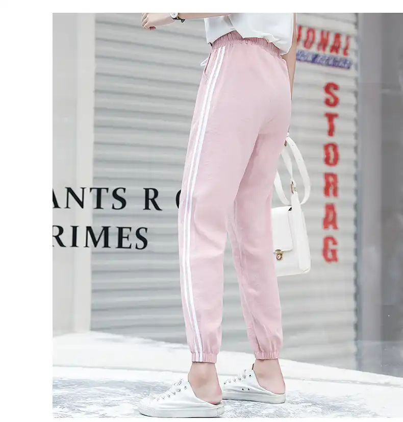 pink joggers with white stripe