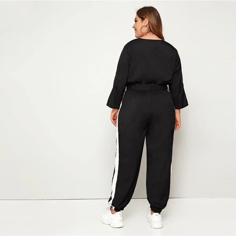 SHEIN плюс размер цветной блок Surplice передний комбинезон с поясом женский весенне-осенний Повседневный v-образный вырез длинный рукав спортивные длинные Комбинезоны